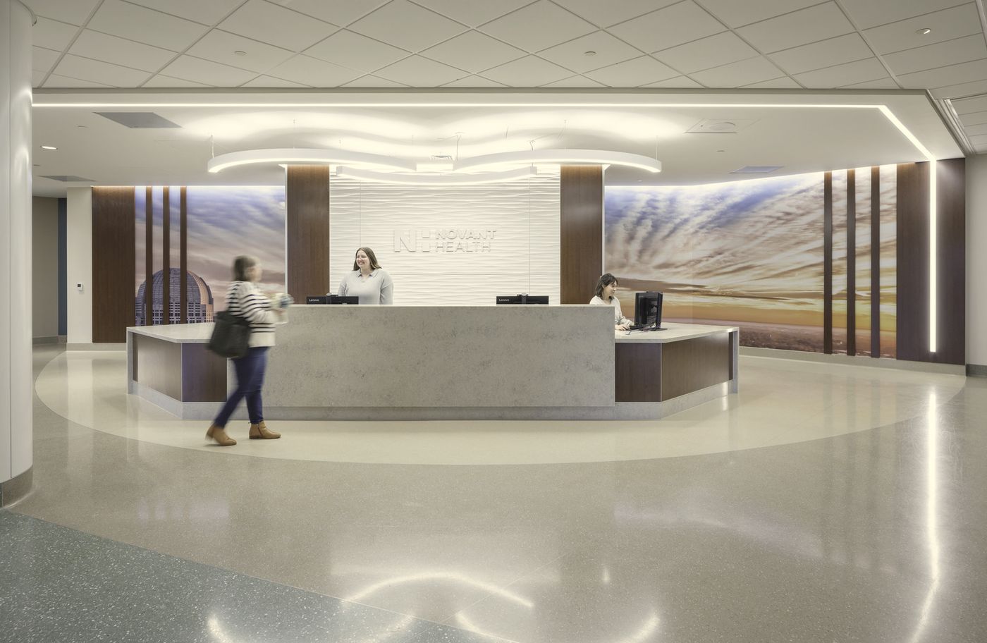 A calm healthcare reception desk with warm wood accents